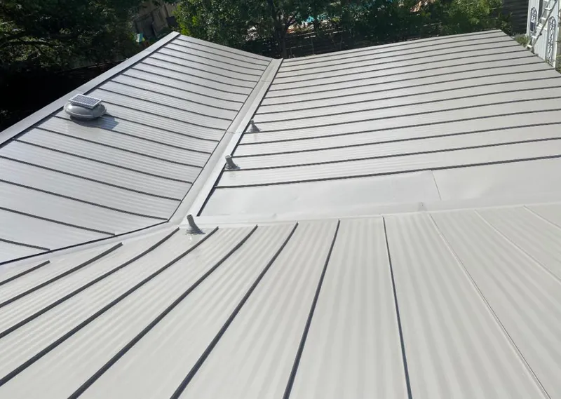 Solar attic fan installed on a metal roof for Roof Ventilation in Perris